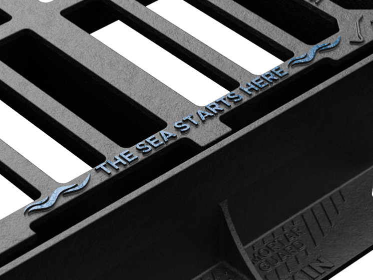 Tristar gully grating with The Sea Starts Here message