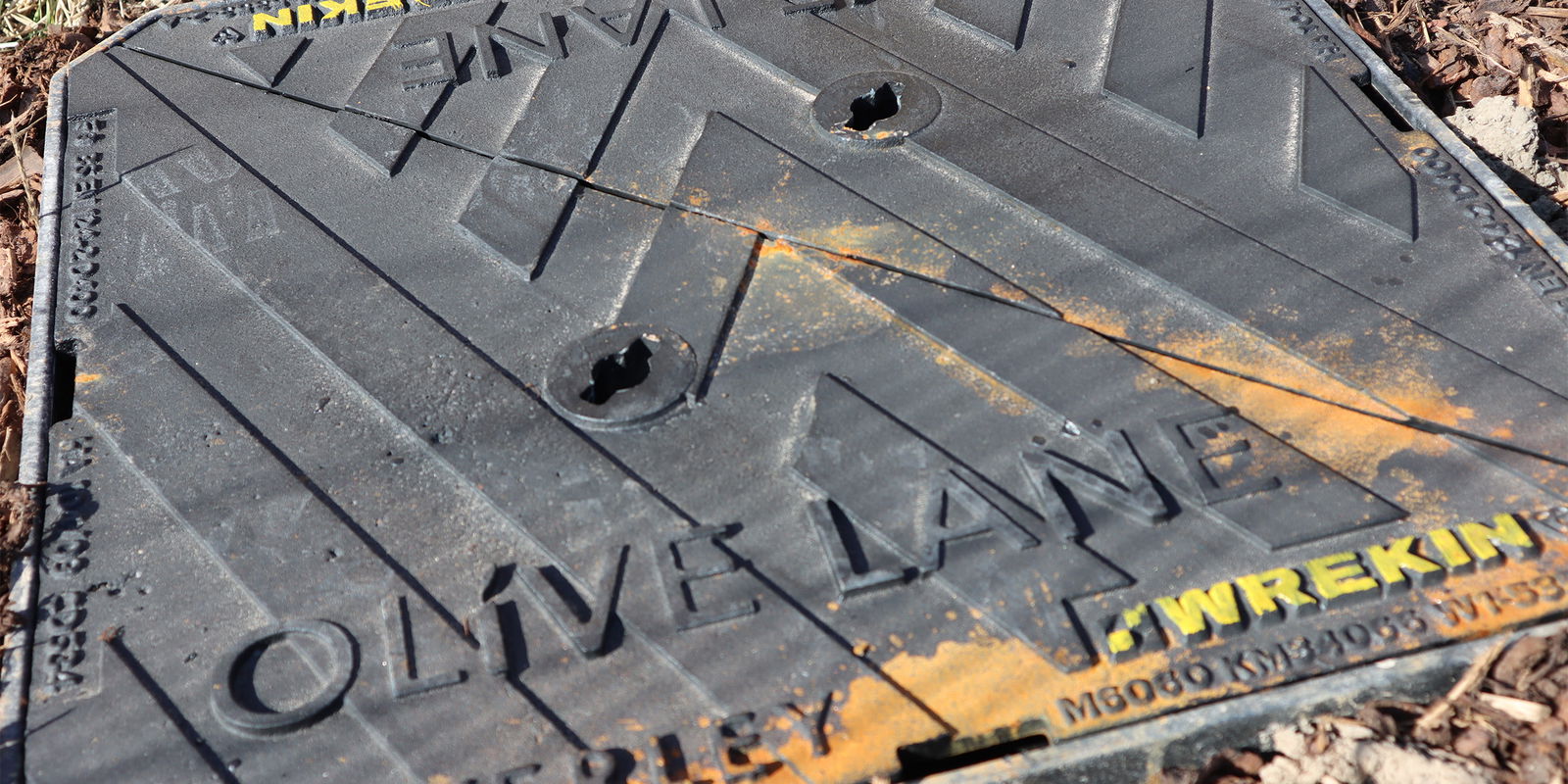 Close up image of bespoke manhole cover at Olive Lane