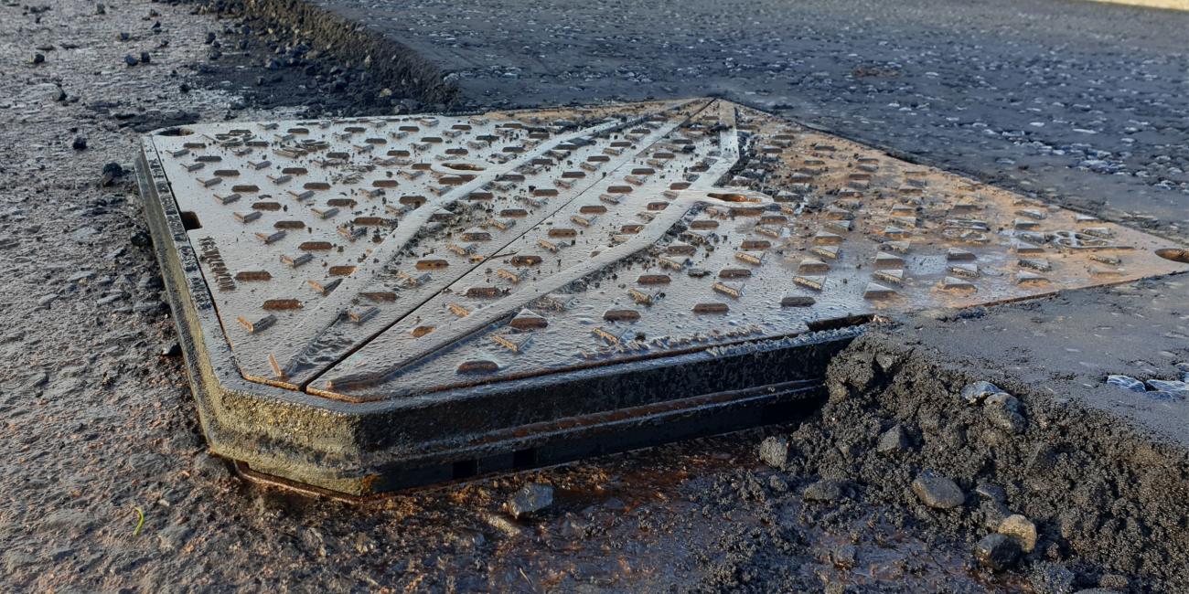 Final road surface being installed around a Wrekin Highway access cover with Clicklift