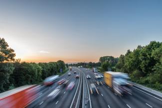 Cars and lorries driving on highway