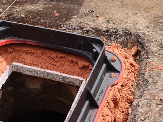 Unite manhole cover frame sitting in Unipak bedding mortar